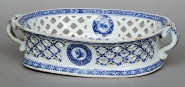 An 18th century Chinese blue and white porcelain basket
Of low dished form with twin handles and