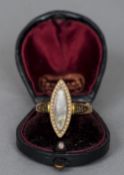 A 19th century 15 ct gold mourning ring
Of navette form, set with seed pearls and with enamel