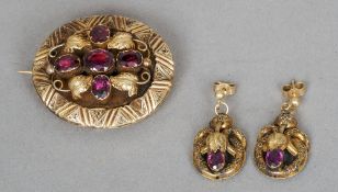 A Victorian amethyst set unmarked yellow metal mourning brooch
Together with a pair of unmarked
