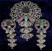 A gold mounted silver, emerald, ruby and diamond pendant
Together with a matching pair of