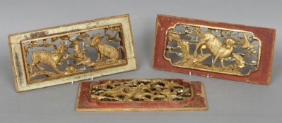 Three Chinese carved and pierced giltwood panels
Each worked with mythical beasts.  The largest 44