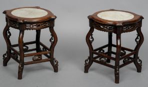 A pair of 19th century Chinese marble inset carved rosewood urn stands
Each of lobed circular form