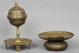 A 19th century Persian brass bowl 
With flattened flared rim and allover floral decoration; together