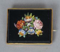 An unmarked yellow metal framed micro-mosaic set brooch
Set as various flowers.  3.5 cms wide.