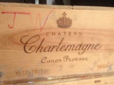 Chateau Charlemagne Canon Fronsac 1995
Twelve bottles in old wooden case.  (12)   CONDITION REPORTS: