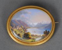 A 19th century unmarked yellow metal mounted Swiss enamelled brooch
Depicting a chateau in a