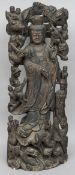 A 19th century Chinese carved wood figure of Guanyin
Modelled standing and surrounded by