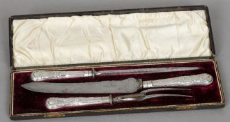 A cased Victorian silver handled three piece carving set, hallmarked Sheffield 1899, maker's mark of