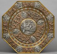 An Eastern white and yellow metal worked brass charger
Of octagonal form and extensively worked with