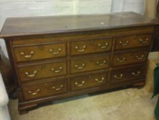 A late 18th/early 19th century oak mule chest
The moulded hinged top above an arrangement of six