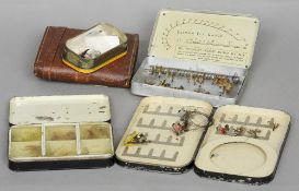 A Hardy black japanned dry fly box, a Malloch black japanned fly box, a Wheatley Kilroy patent