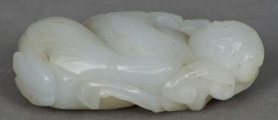 A Chinese white jade carving
Formed as a crouching boy.  6.5 cms high.   CONDITION REPORTS:  Overall