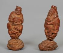Two small 19th century Chinese figures
Each carved from a nut.  Each 4.5 cms high.  (2)