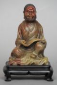 A late 19th century well carved Chinese soapstone model of a deity
Modelled wearing floral robes and