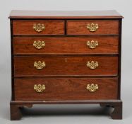 A George III mahogany chest of drawers
The moulded rectangular top above two short and three long