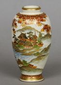 A Japanese Satsuma vase
Decorated in autumnal colours with pagodas in a lakeside mountainous