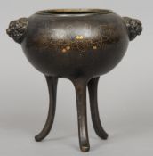 A Chinese patinated bronze censor
The bulbous body with gilt on laid decoration and twin mask
