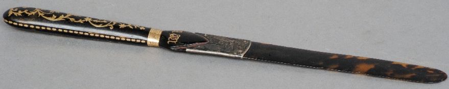 A 19th century unmarked gold inlaid tortoiseshell paper knife
The handle with gold floral inlays and