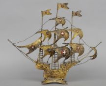 A 19th century unmarked silver gilt filigree model of a galleon
Of intricate pierced design, the