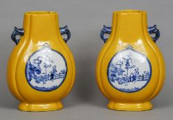 A pair of Chinese porcelain twin handled baluster vases
Each of quatrefoil section and decorated