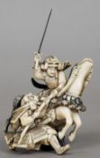 A late 19th/early 20th century Japanese ivory okimono
Formed as warring Samurais, one on horseback.