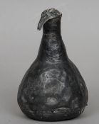 A 19th century or earlier North African bronze weight
The finial modelled as a stylised bird's head.