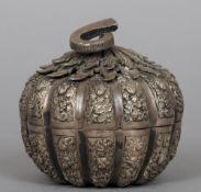 A 19th century white metal presentation box
In the form of a melon with segmented scrolling floral