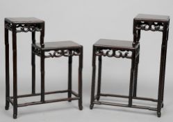 A matched pair of late 19th/early 20th century Chinese carved hardwood urn stands
Each of stepped