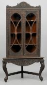 A 19th century Anglo-Indian rosewood corner cabinet on stand
With profusely carved and pierced