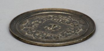 A 19th century Chinese bronze mirror
Of typical circular form.  15.5 cms diameter.   CONDITION