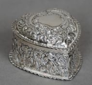 A Victorian silver trinket box, hallmarked Birmingham 1895
Of embossed heart form.  5 cms wide.