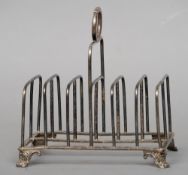 A George IV silver toast rack, hallmarked London 1825, maker's mark of JA
Of typical form with a