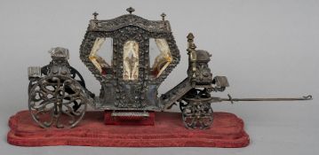 A Continental white metal model of a carriage, signed P. Chimeri
Standing on a damask covered plinth