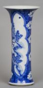 A Chinese blue and white porcelain sleeve vase
With flared rim decorated with figures in a riverside