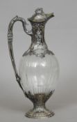 A 19th century French silver mounted cut glass claret jug, hallmarked for export
The embossed mounts