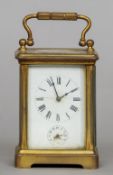 A small 19th century brass cased carriage alarm clock
With Roman numerals and Arabic numeral alarm