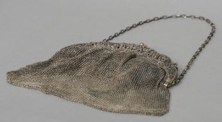 A German silver mesh purse, stamped 800, makers mark indistinct
The clasp decorated with dancing