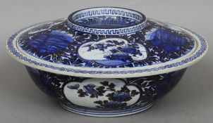 A large Chinese porcelain gilt heightened blue and white rice bowl and cover, probably Kangxi