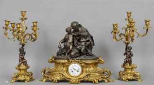 A bronze mounted ormolu cased triple clock garniture
Surmounted with the figure of a lady and two