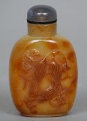 A Chinese carved agate snuff bottle
Worked with insects amongst two courgettes.  7 cms high.