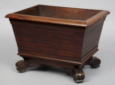 A 19th  century mahogany wine cooler
Of moulded tapering rectangular form enclosing a zinc liner,