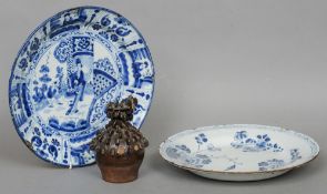 An 18th century Dutch blue and white Delft charger
Decorated in the Kangxi style; another, decorated