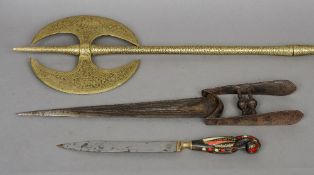 An 18th century katar, an Indian parade axe
With engraved decoration; and a small horn handled