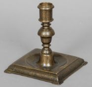 An early 17th century Italian bronze square based candlestick, possiblly Veneto Saacenic 
With