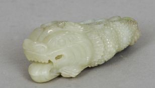 A Chinese carved jade model formed as a lucky or money frog
Of typical form.  10 cms long.