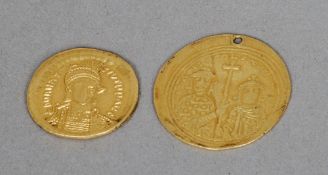 Two early high carat gold coins, possibly Roman
The largest 2.5 cms diameter.  (2)   CONDITION