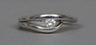 An 18 ct white gold diamond set ring
The stone centrally set between twin bands of white gold.