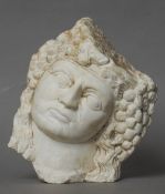 An early carved stone head
Modelled as a Bacchic figure.  22 cms high.   CONDITION REPORTS: