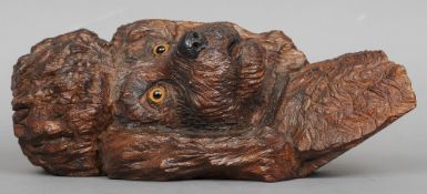 A Blackforest carved wall hanging poodle mask
With glass eyes, the verso signed C. Leeson.  36.5 cms