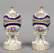 A pair of Sevres pot pourri vases and covers
Each with pierced hinged cover above an ovoid body